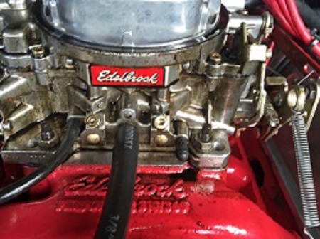 breather hose line to base of Edelbrock