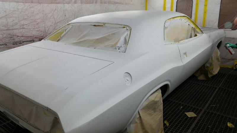 Guide coat being applied over polyester filler before further flatting.