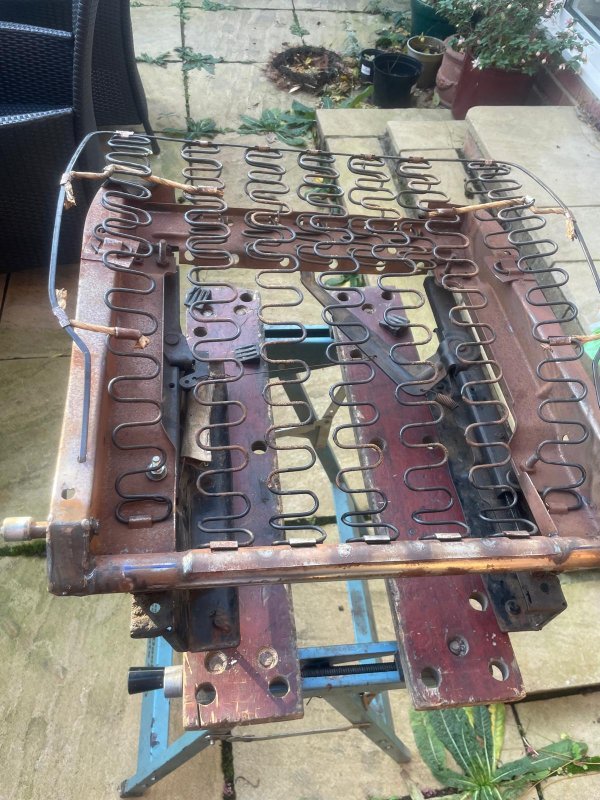 seat pan  flat spring steel spring support and springs.  this was the good seat.  The springs and flat spring steel support on the drivers seat were snapped and exceedingly rusty.shows the &quot;stays&quot;/&quot;tethers between spring 1 and 2 each side