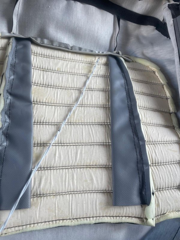 homemade coat hanger listing wires for seat side skirt area