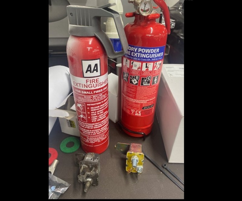 The tiny AA that saved me. Its big new replacement. Note the starter relays.