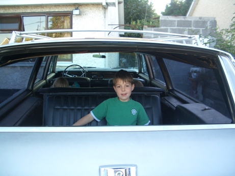 Hugo in way back of Chrysler granddads house Oct 07 small.JPG