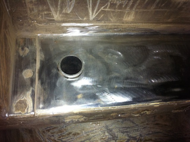 this is the hole in the chassis -its in exactly the right place-thanx ma mopar-sleeve is in place after drilling to suit.....