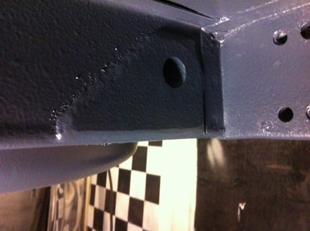 now welded in place and the first signs of coating......