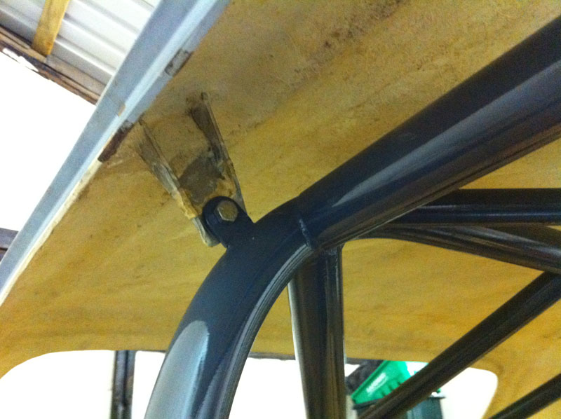 Upper rear of righthand door opening (roof)