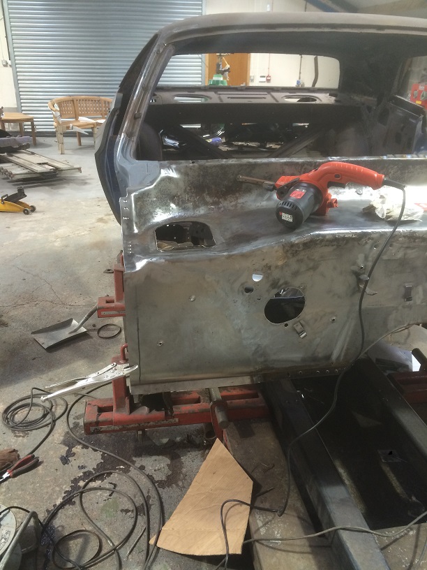 cleaned up passenger side of firewall, waiting to be welded to door post