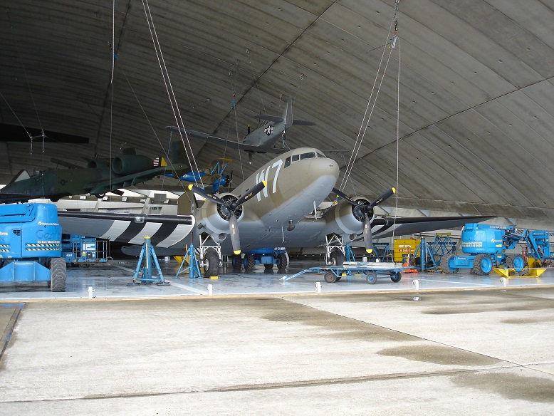 C47 having been lowered from the ceiling. Harvard/Texan above, A10 Thunderbolt to left,